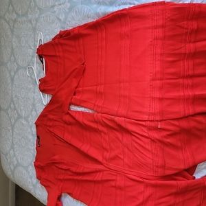 Sleeveless dress with over long sweater.